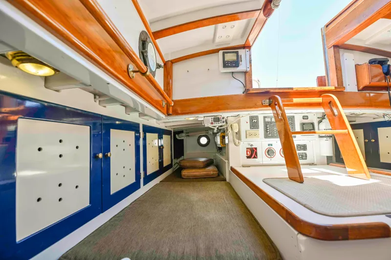 Slide: The Image of Interior of 1927 Schock Staysail Schooner with wooden accents and nautical equipment. - 13