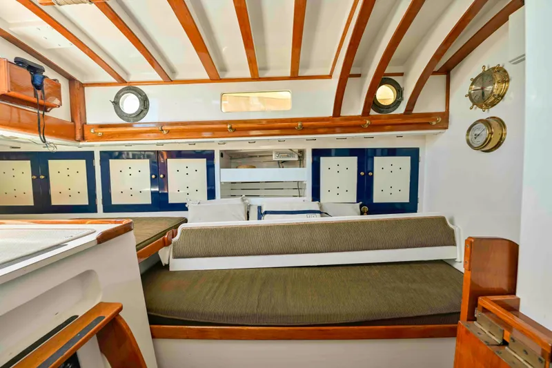Slide: The Image of Interior of 1927 Schock Staysail Schooner with wooden beams and nautical decor. - 19