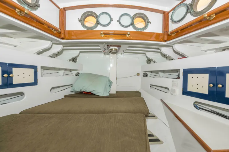 Slide: The Image of Interior cabin of 1927 Schock Staysail Schooner with cozy bunks and portholes. - 23
