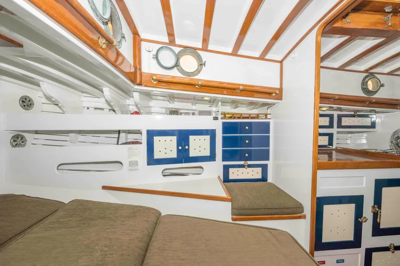 Slide: The Image of Interior of a 1927 Schock Staysail Schooner with wooden beams and nautical decor. - 27