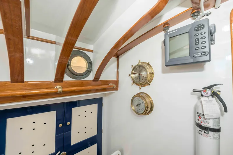 Slide: The Image of Interior of 1927 Schock Staysail Schooner with nautical instruments and fire extinguisher. - 38