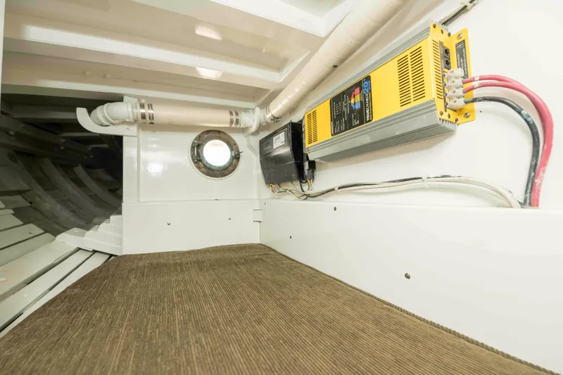 Slide: The Image of Interior of 1927 Schock Staysail Schooner with electrical equipment and porthole. - 42