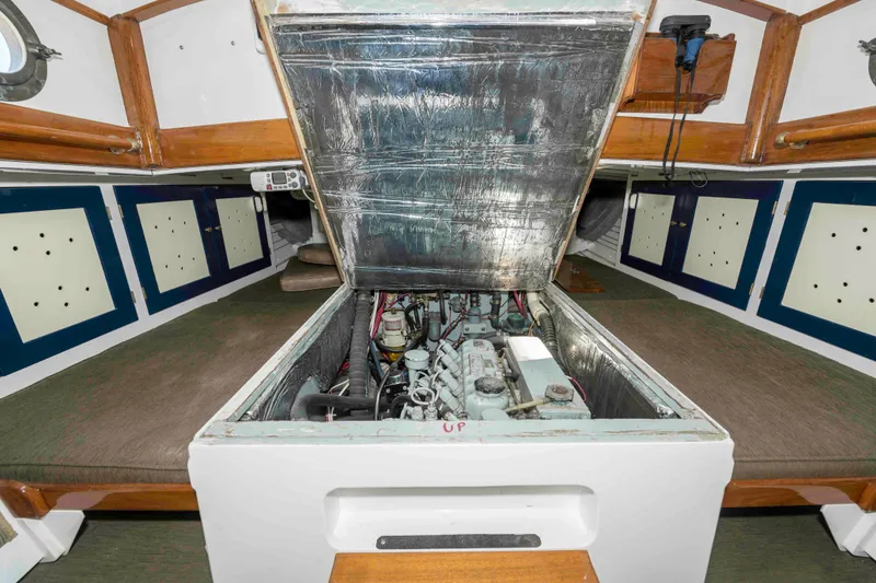 Slide: The Image of Engine compartment of a 1927 Schock Staysail Schooner, showcasing interior design and mechanical components. - 48