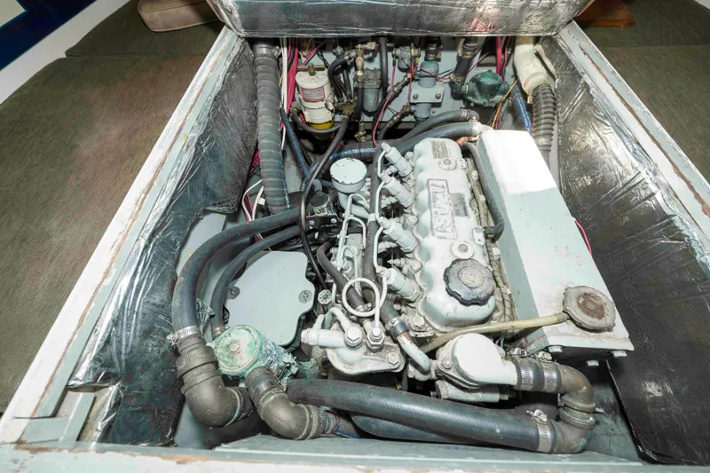 Slide: The Image of Engine compartment of a 1927 Schock Staysail Schooner, showcasing mechanical components and wiring. - 49