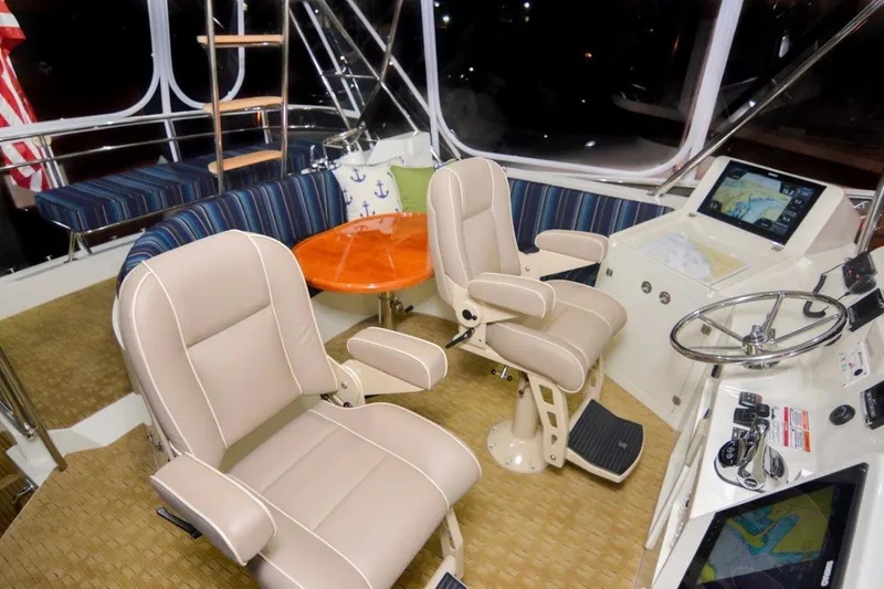 Slide: The Image of Interior of 2026 Mikelson 50 Generation II Sportfisher with helm, seating, and navigation equipment. - 10