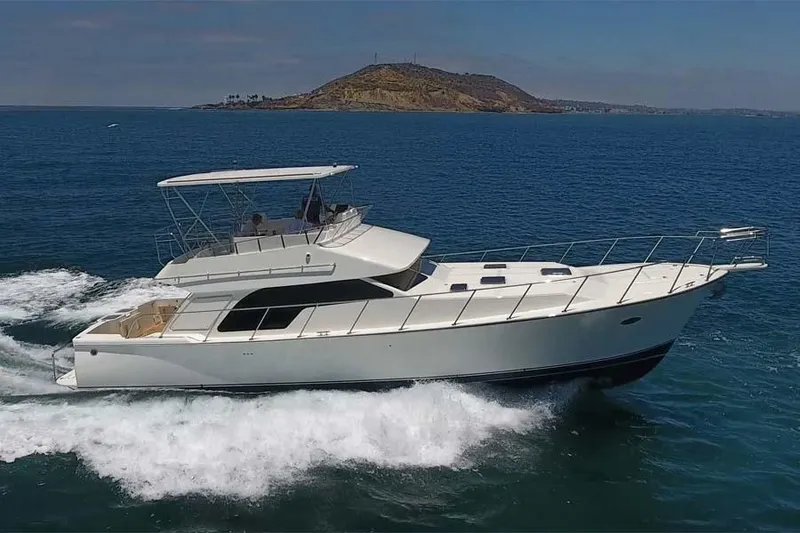 Slide: The Image of 2026 Mikelson 50 Generation II Sportfisher cruising on open water. - 2