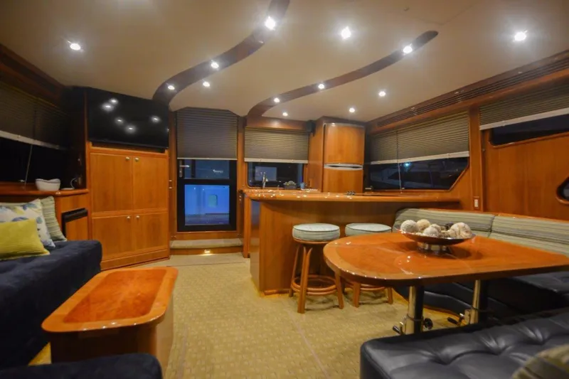 Slide: The Image of Luxurious interior of 2026 Mikelson 50 Generation II Sportfisher yacht with elegant wood finishes. - 4