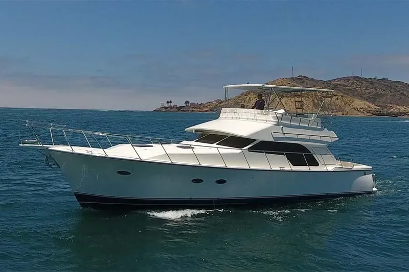 Slide: The Image of 2026 Mikelson 50 Generation II Sportfisher yacht cruising on open water. - 1