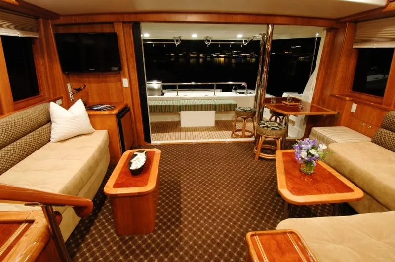 Slide: The Image of Luxurious interior of 2026 Mikelson Nomad Long Range Cruising Sportfish yacht, featuring elegant seating and decor. - 7