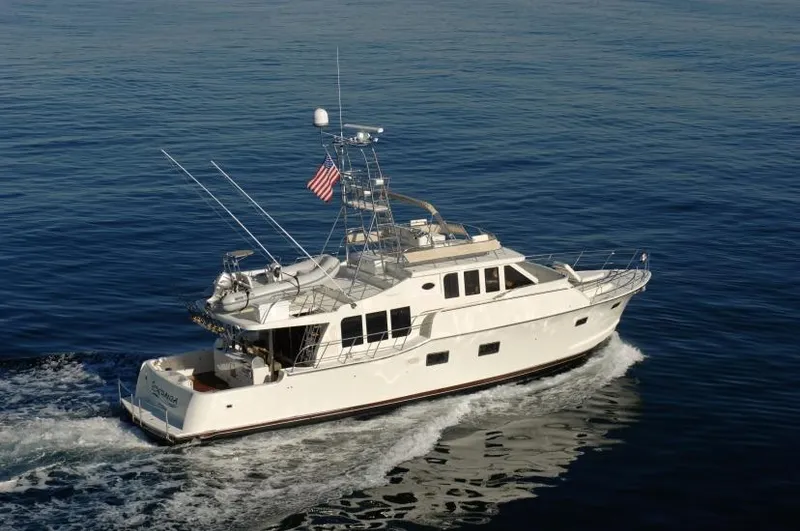 Slide: The Image of 2026 Mikelson Nomad Long Range Cruising Sportfish yacht on open water. - 2