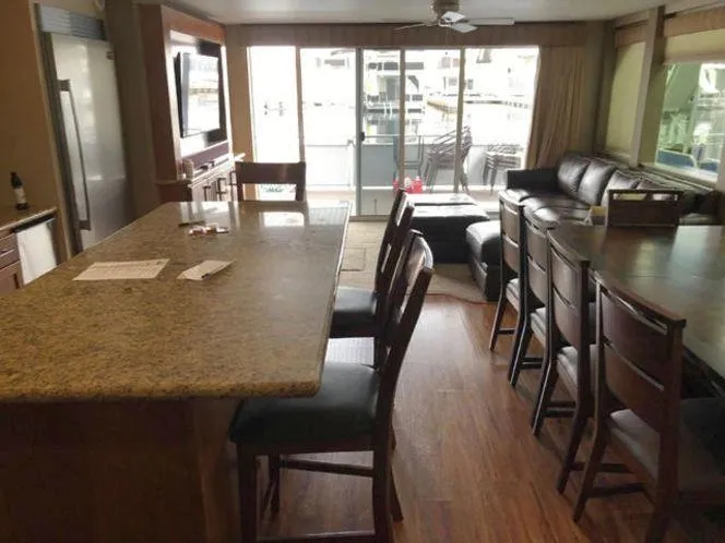 Slide: The Image of Interior of 2015 Bravada Why Knot Week 10 houseboat with modern kitchen and living area. - 11