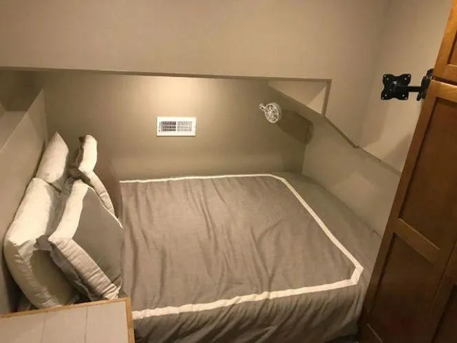 Slide: The Image of Compact bedroom in 2015 Bravada Why Knot Week 10 houseboat with cozy bed and storage. - 15