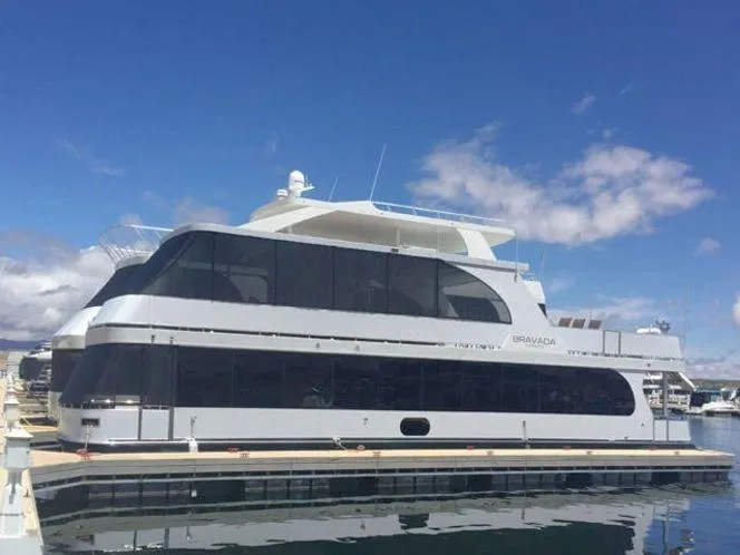 Slide: The Image of 2015 Bravada Why Knot Week 10 yacht docked at marina under clear blue sky. - 26