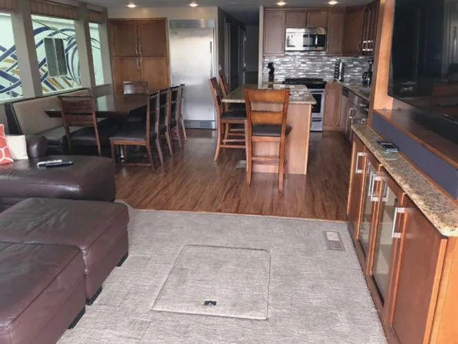 Slide: The Image of Modern houseboat interior with kitchen, dining area, and living room, Bravada Why Knot Week 10, 2015. - 30