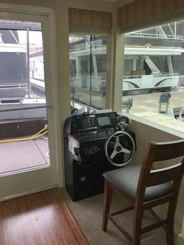 Slide: The Image of Interior helm station of 2015 Bravada Why Knot Week 10 houseboat. - 34