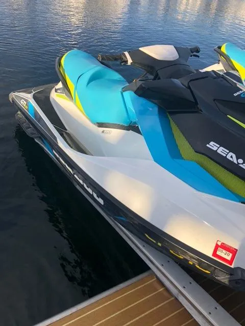 Slide: The Image of 2015 Bravada Why Knot Week 10 jet ski docked on water. - 5