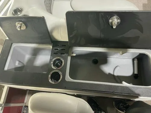 Slide: The Image of 2019 Ranger 220FC boat storage compartments and cup holders. - 12