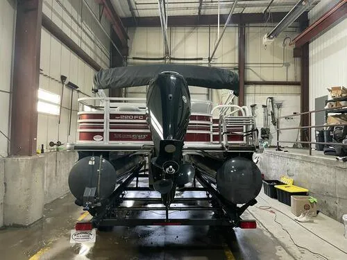 Slide: The Image of 2019 Ranger 220FC pontoon boat in indoor storage facility. - 5