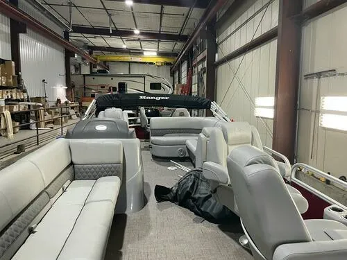 Slide: The Image of 2019 Ranger 220FC pontoon boat in a warehouse, interior view. - 7