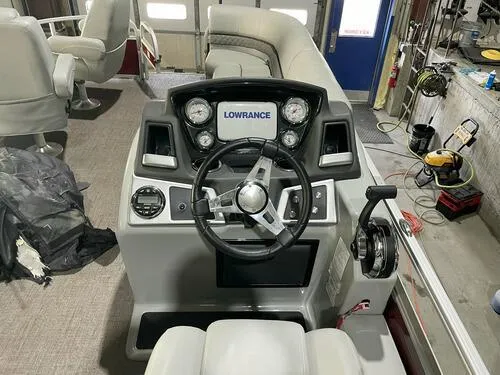 Slide: The Image of 2019 Ranger 220FC boat dashboard with Lowrance electronics in a workshop. - 8