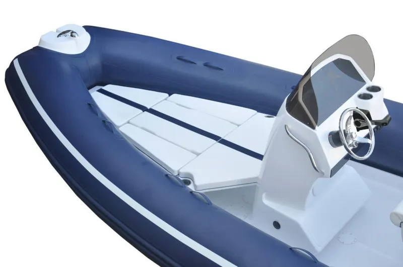 Slide: The Image of 2024 AB Inflatables 21 VST boat with blue and white design. - 5