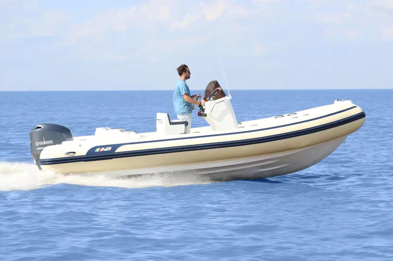 Slide: The Image of 2024 AB Inflatables 21 VST boat cruising on open water. - 8