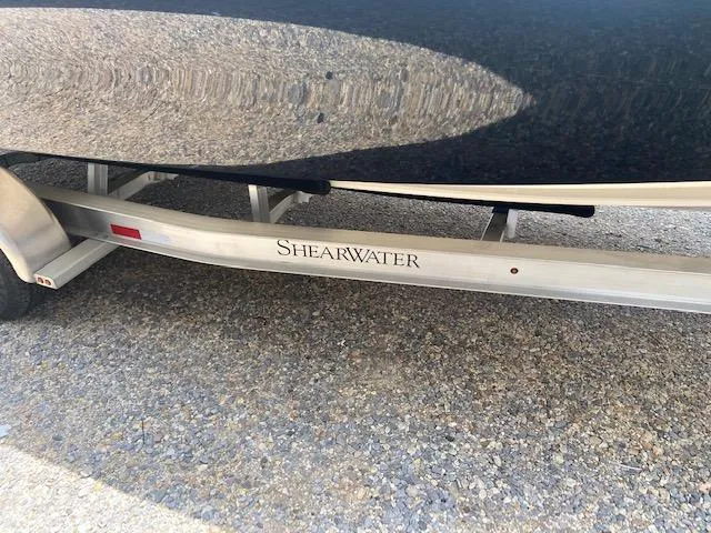 Slide: The Image of 2014 ShearWater 26 Carolina boat on trailer. - 10