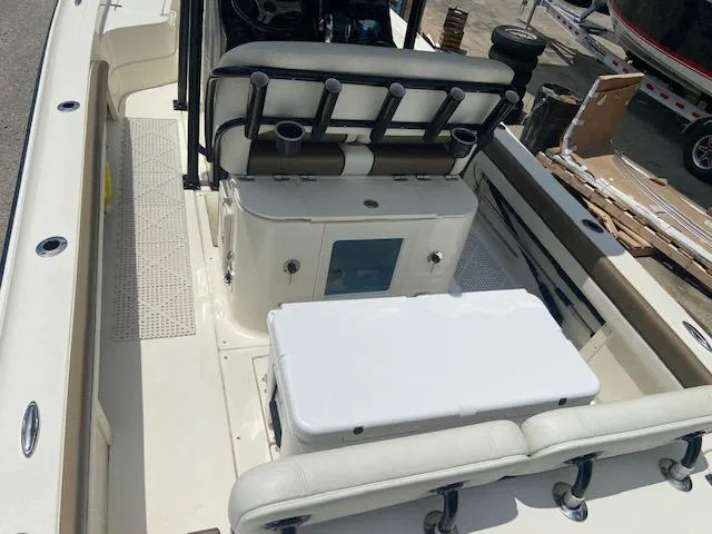 Slide: The Image of 2014 ShearWater 26 Carolina boat interior with seating and storage. - 12