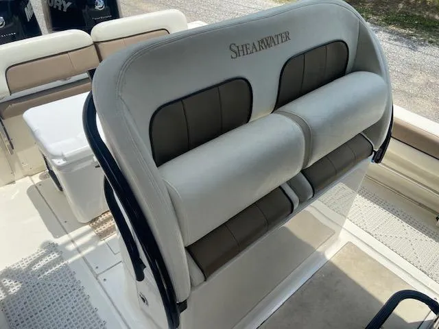 Slide: The Image of 2014 ShearWater 26 Carolina boat seating and interior. - 19
