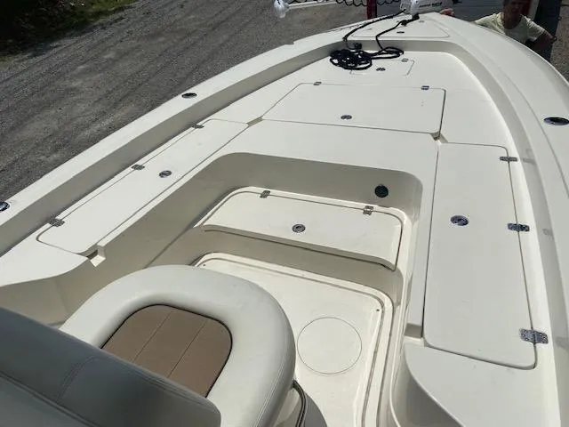 Slide: The Image of 2014 ShearWater 26 Carolina boat deck with storage compartments and seating. - 21