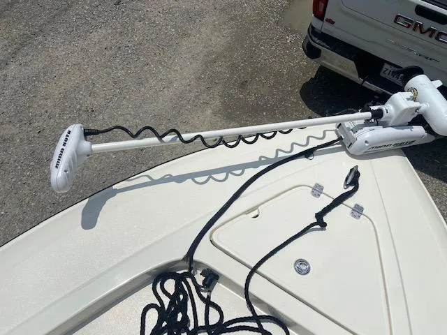 Slide: The Image of 2014 ShearWater 26 Carolina boat with Minn Kota trolling motor and GMC truck in background. - 23