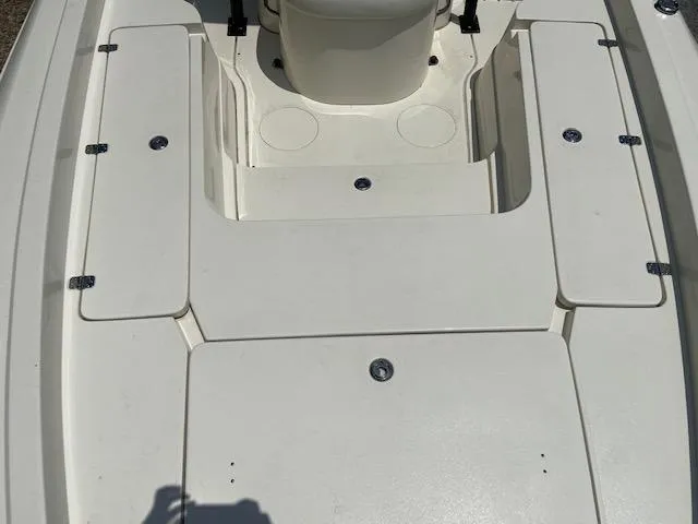 Slide: The Image of 2014 ShearWater 26 Carolina boat deck with storage compartments. - 25