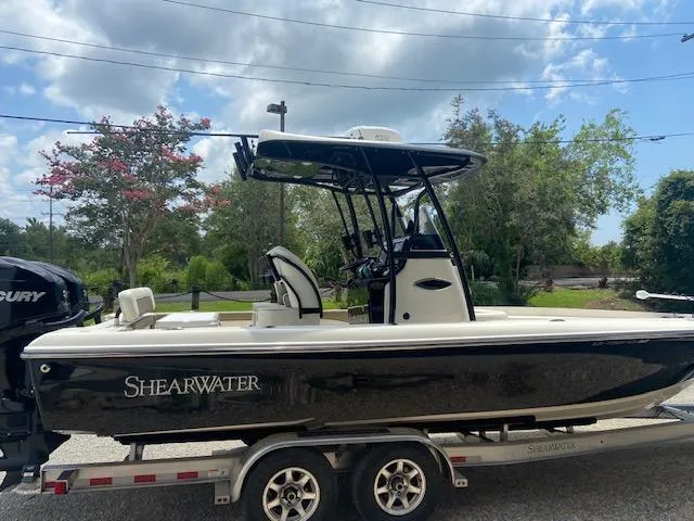 Slide: The Image of 2014 ShearWater 26 Carolina boat on a trailer, side view. - 8