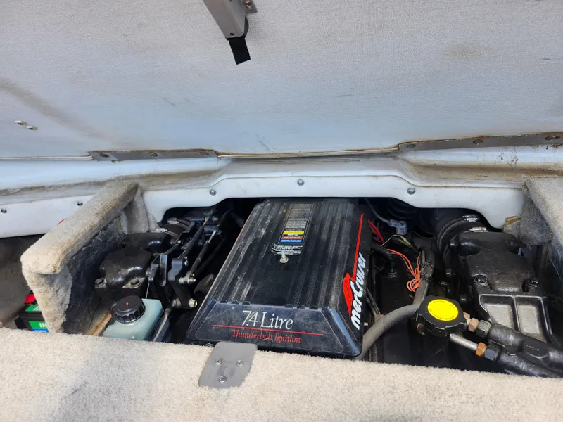 Slide: The Image of 1998 Crownline 202 CC boat engine compartment with 7.4L MerCruiser engine. - 12
