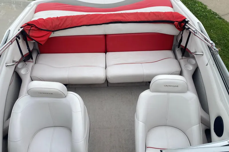 Slide: The Image of 1998 Crownline 202 CC boat interior with white and red seating. - 3