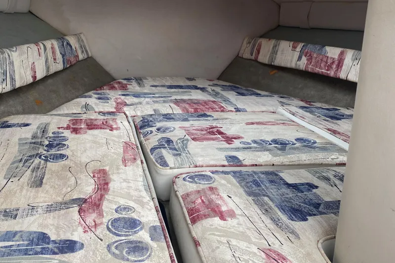 Slide: The Image of Interior cabin of a 1998 Crownline 202 CC boat with patterned cushions. - 4