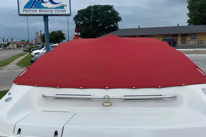 Slide: The Image of 1998 Crownline 202 CC boat with red cover at Premier Boating Center. - 5