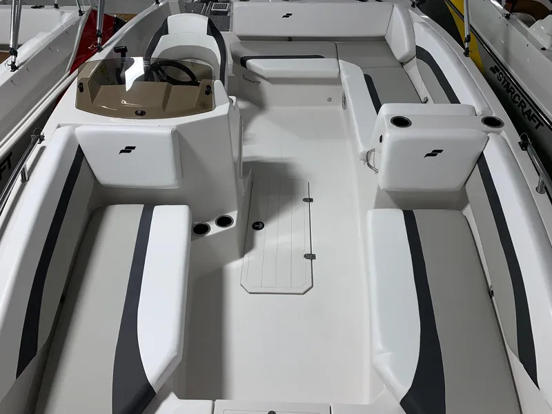 Slide: The Image of 2024 Starcraft SVX 171 boat interior with seating and steering console. - 10