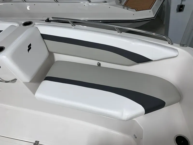 Slide: The Image of 2024 Starcraft SVX 171 boat interior seating with white and gray upholstery - 11