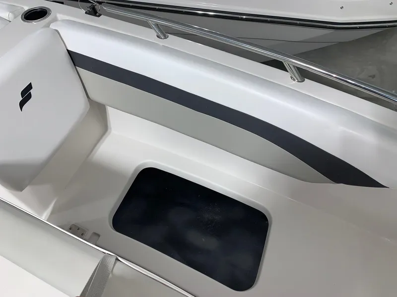 Slide: The Image of 2024 Starcraft SVX 171 boat interior with seating and storage compartment. - 12