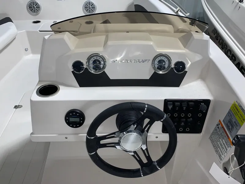 Slide: The Image of 2024 Starcraft SVX 171 boat dashboard with steering wheel and control panel. - 6