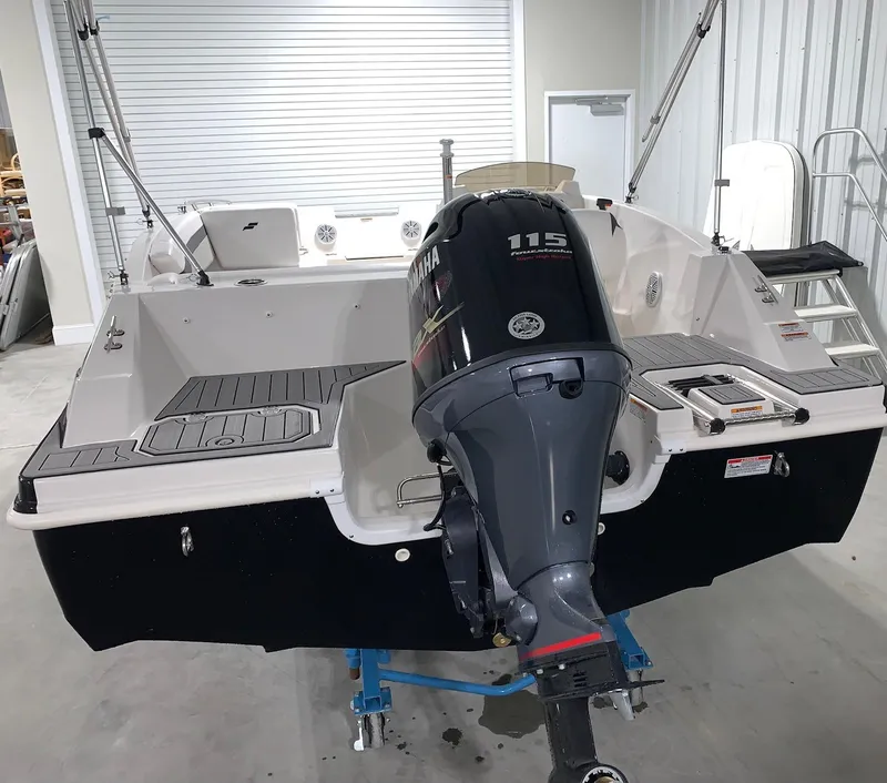 Slide: The Image of 2024 Starcraft SVX 171 boat with Yamaha 115 outboard motor in a showroom. - 8