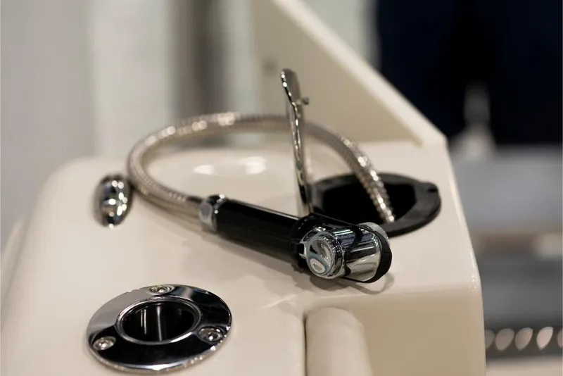 Slide: The Image of Close-up of 2023 Sailfish 316 DC boat's deck shower and fittings. - 10