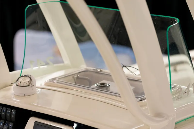 Slide: The Image of 2023 Sailfish 316 DC boat dashboard with compass and windshield. - 15