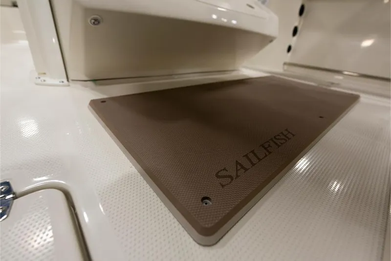Slide: The Image of 2023 Sailfish 316 DC boat interior with branded mat. - 16