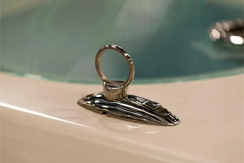 Slide: The Image of Close-up of a 2023 Sailfish 316 DC boat's chrome cleat. - 19