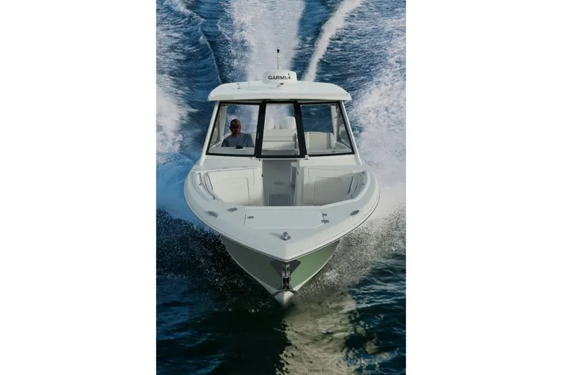 Slide: The Image of 2023 Sailfish 316 DC boat cruising on water. - 24