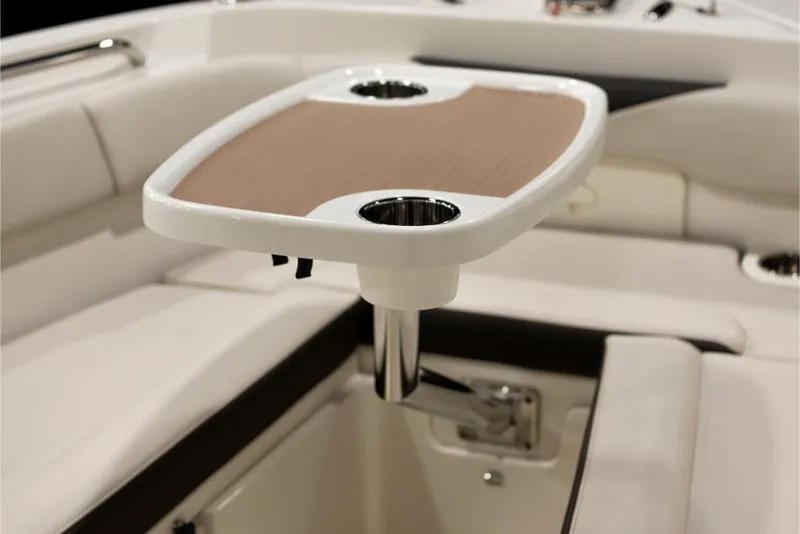 Slide: The Image of 2023 Sailfish 316 DC boat interior with table and cup holders. - 8
