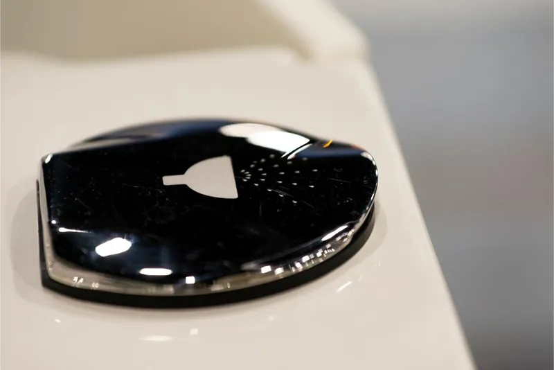 Slide: The Image of Close-up of a 2023 Sailfish 316 DC boat's chrome shower button. - 9