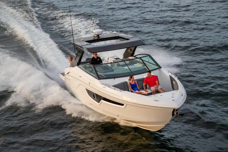 Slide: The Image of 2023 Cruisers Yachts 34 GLS I/O cruising on water with passengers onboard. - 3